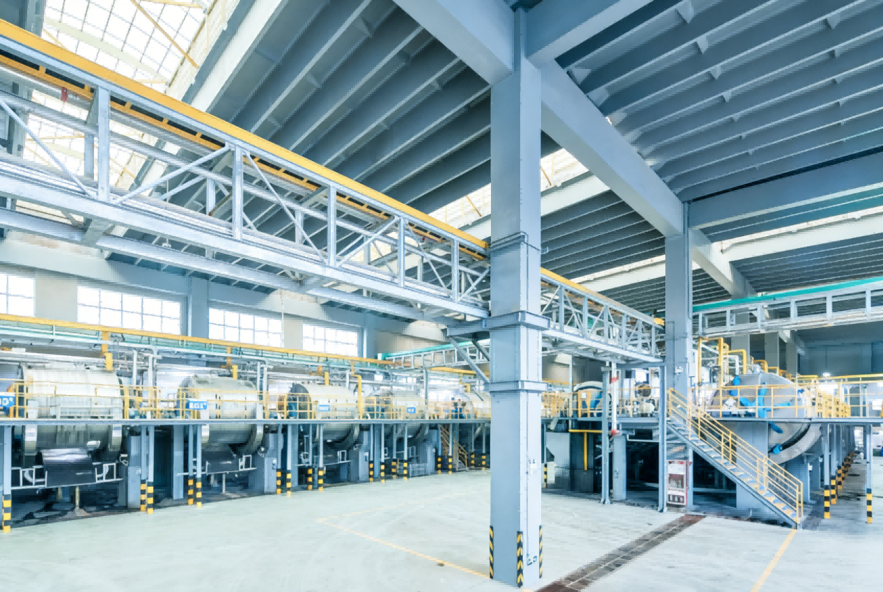 Factory production hall with industrial equipment and a mezzanine walkway