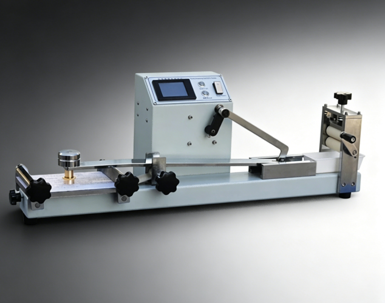Benchtop materials test instrument with specimen fixtures and a digital display