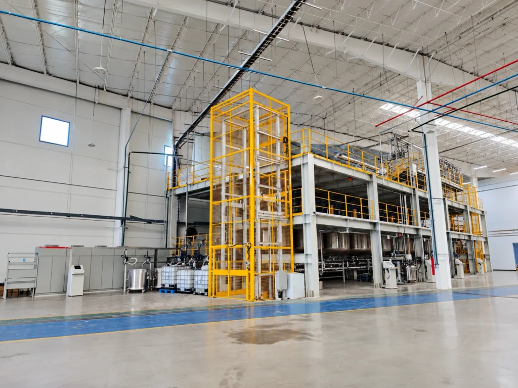 Anonymized resin batching installation with vessels, pipework and multi-level platforms