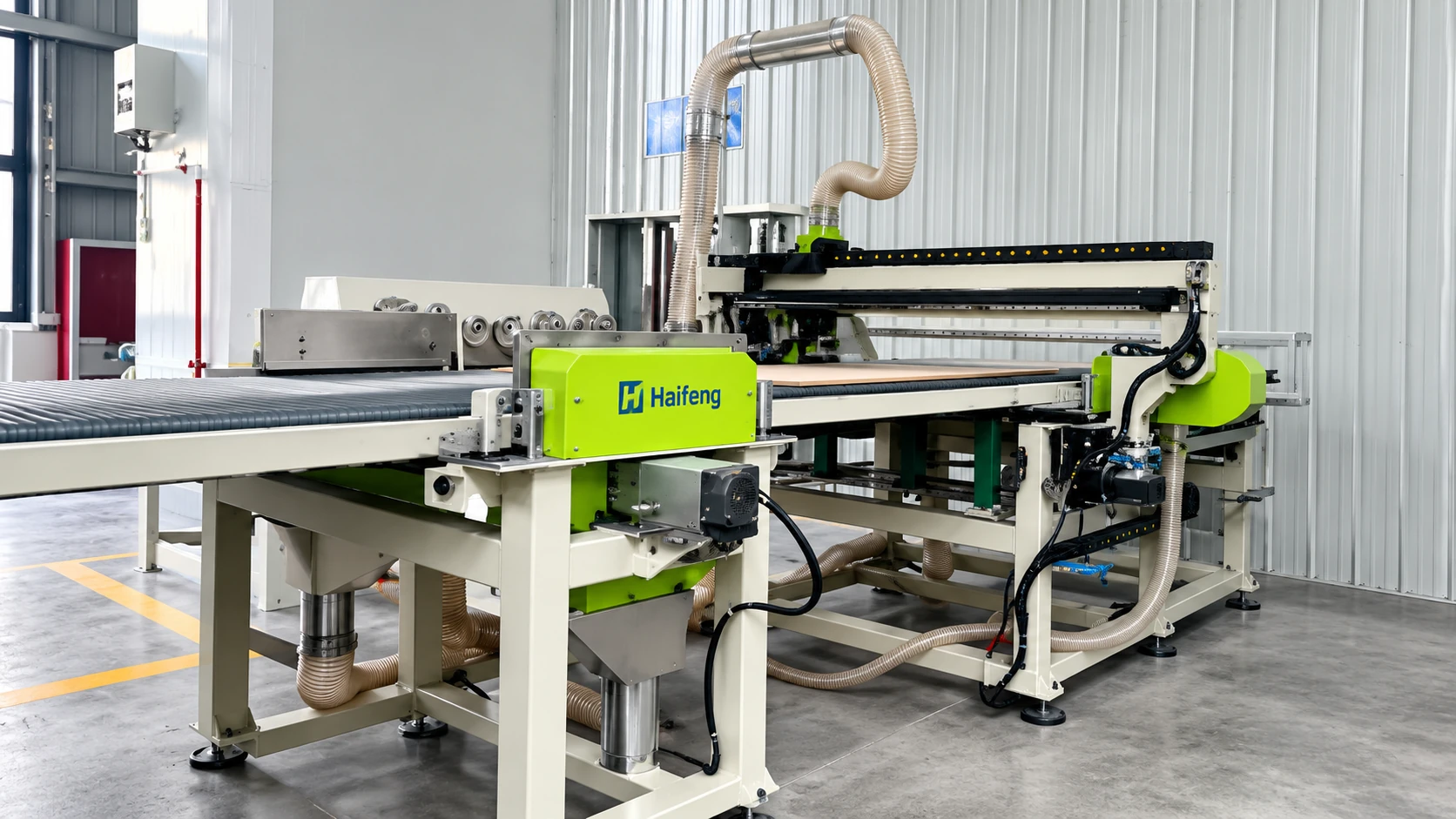 Sandwich panel production equipment illustration: cutting gantry with dust extraction