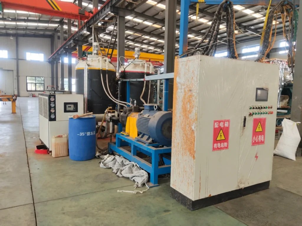 Metering drive, control cabinet and material tanks of pipe-insulation foaming equipment in Liaoning.